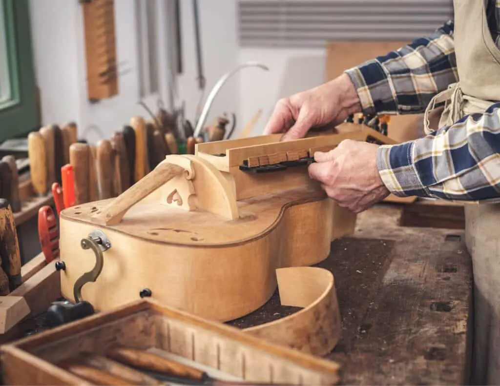 Instrument builder making a hurdy-gurdy.