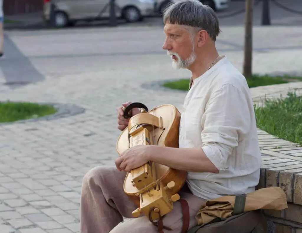 Street performer playing a hurdy-gurdy