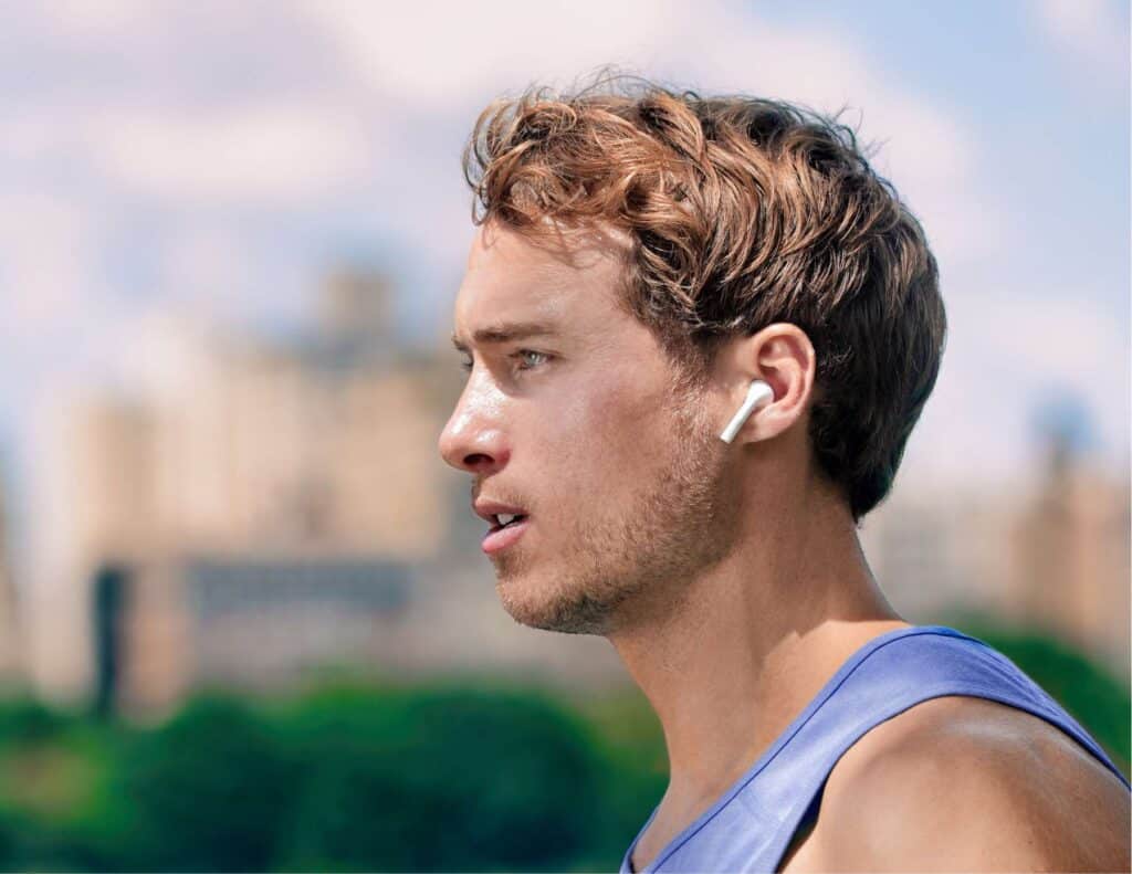 Man wearing wireless ear buds