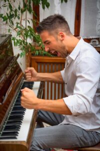 Frustrated man at the piano